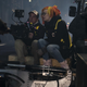 Lana Wachowski sitting down during filming.